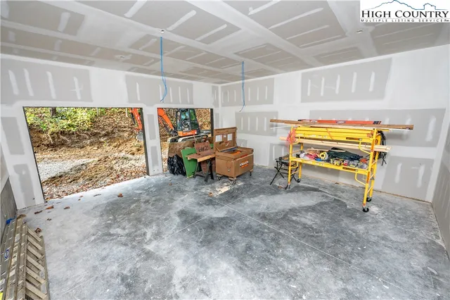 a room with furniture and a large window