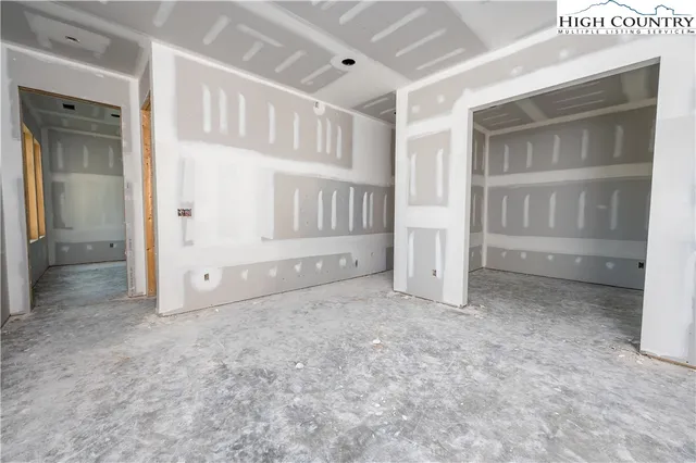 a view of a balcony with furniture and wooden floor