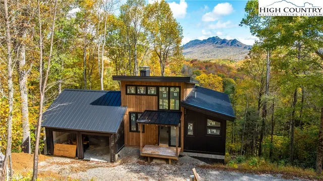 a view of a house with a iron fence