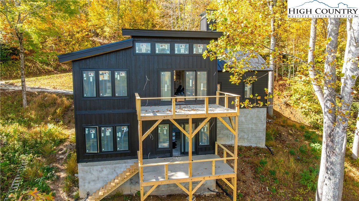 63 Two Hawks Lane Newland, NC 28657 - Photo 6 of 23 a front view of a house with garden