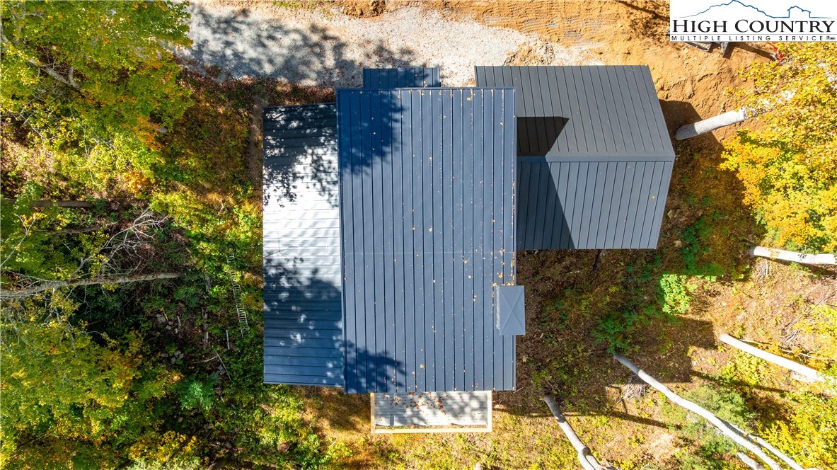 63 Two Hawks Lane Newland, NC 28657 - Photo 8 of 23 a view of a house with a small yard