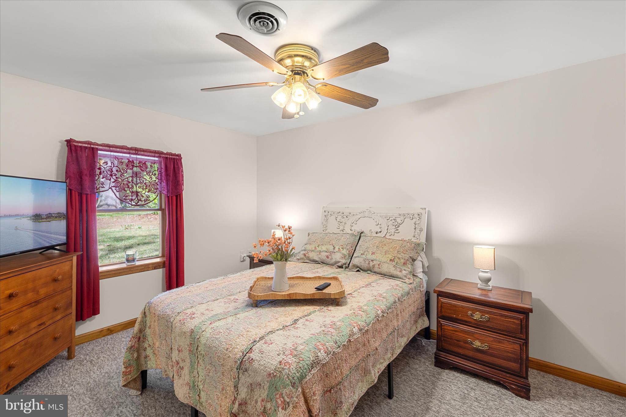 251 Rings End Road Millington, MD 21651 - Photo 18 of 47 a bedroom with a bed and a large window