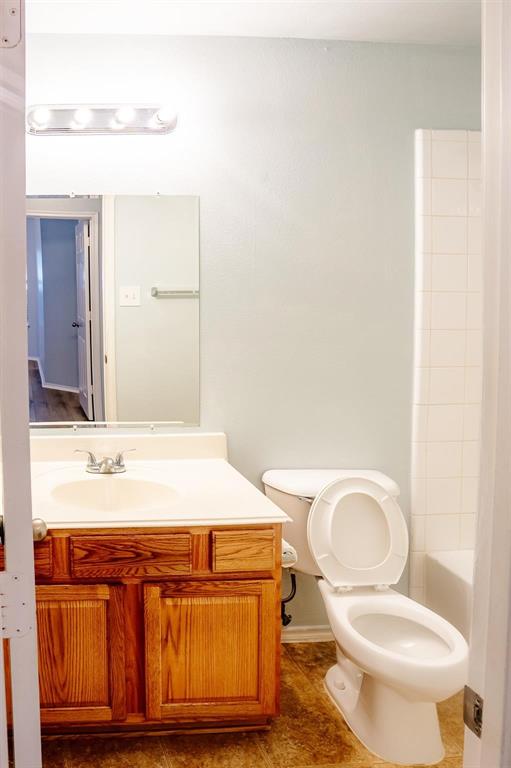 712 Corral Street Cross Roads, TX 76227 - Photo 8 of 20 a bathroom with a granite countertop toilet and a sink
