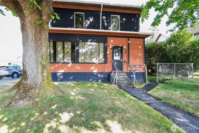 front view of a house with a yard