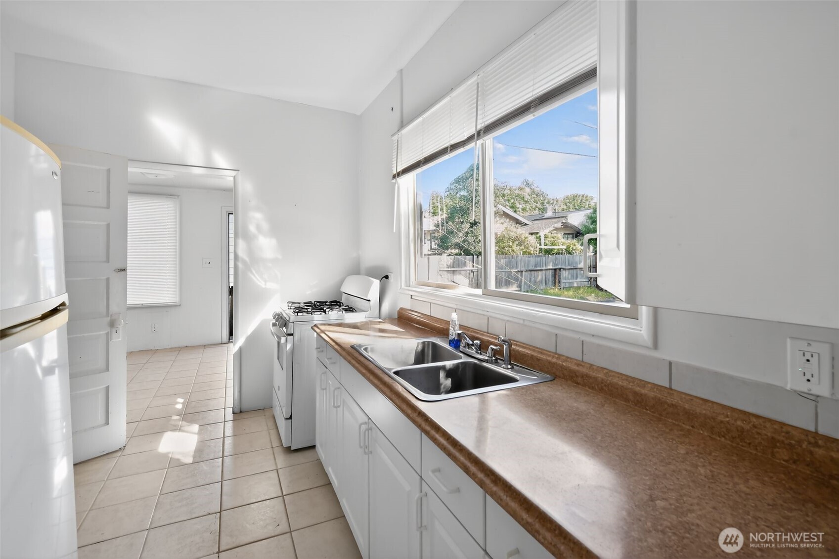 208 North M Street Aberdeen, WA 98520 - Photo 8 of 18 a kitchen with a sink and a stove top oven