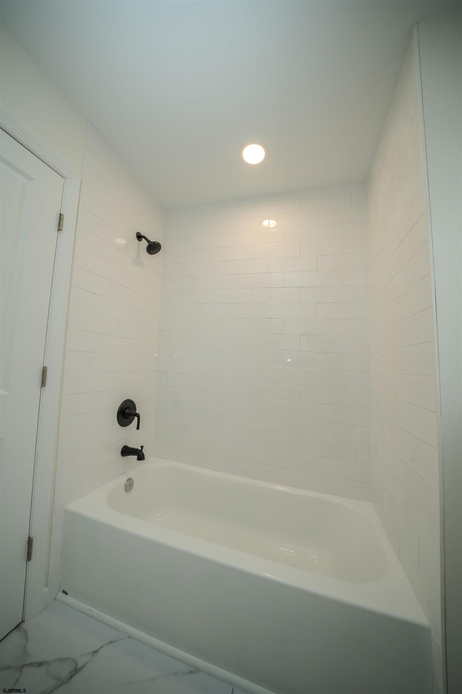115 Ryon Avenue Pleasantville, NJ 08232 - Photo 12 of 12 a bathroom with a bathtub