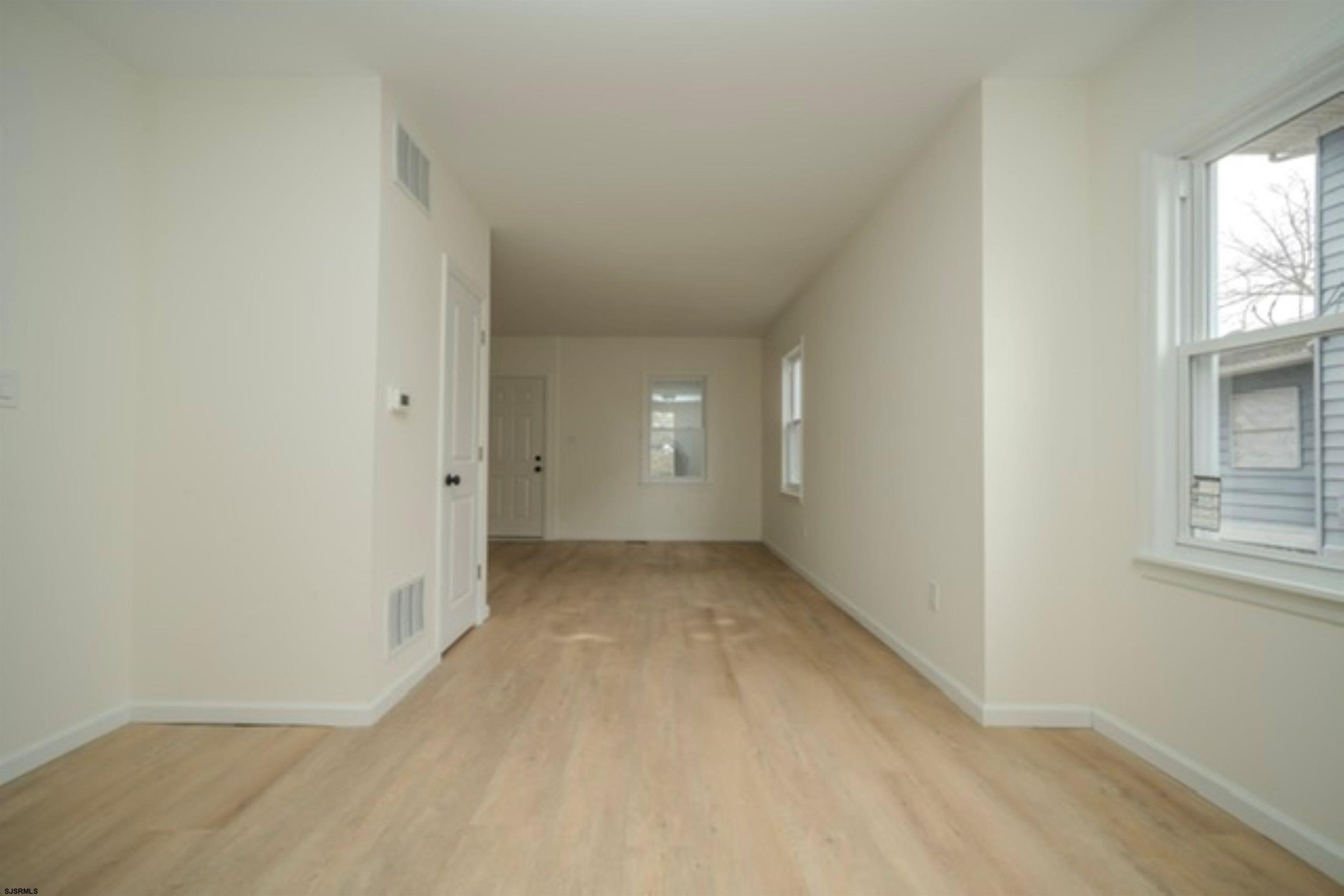 115 Ryon Avenue Pleasantville, NJ 08232 - Photo 5 of 12 an empty room with windows