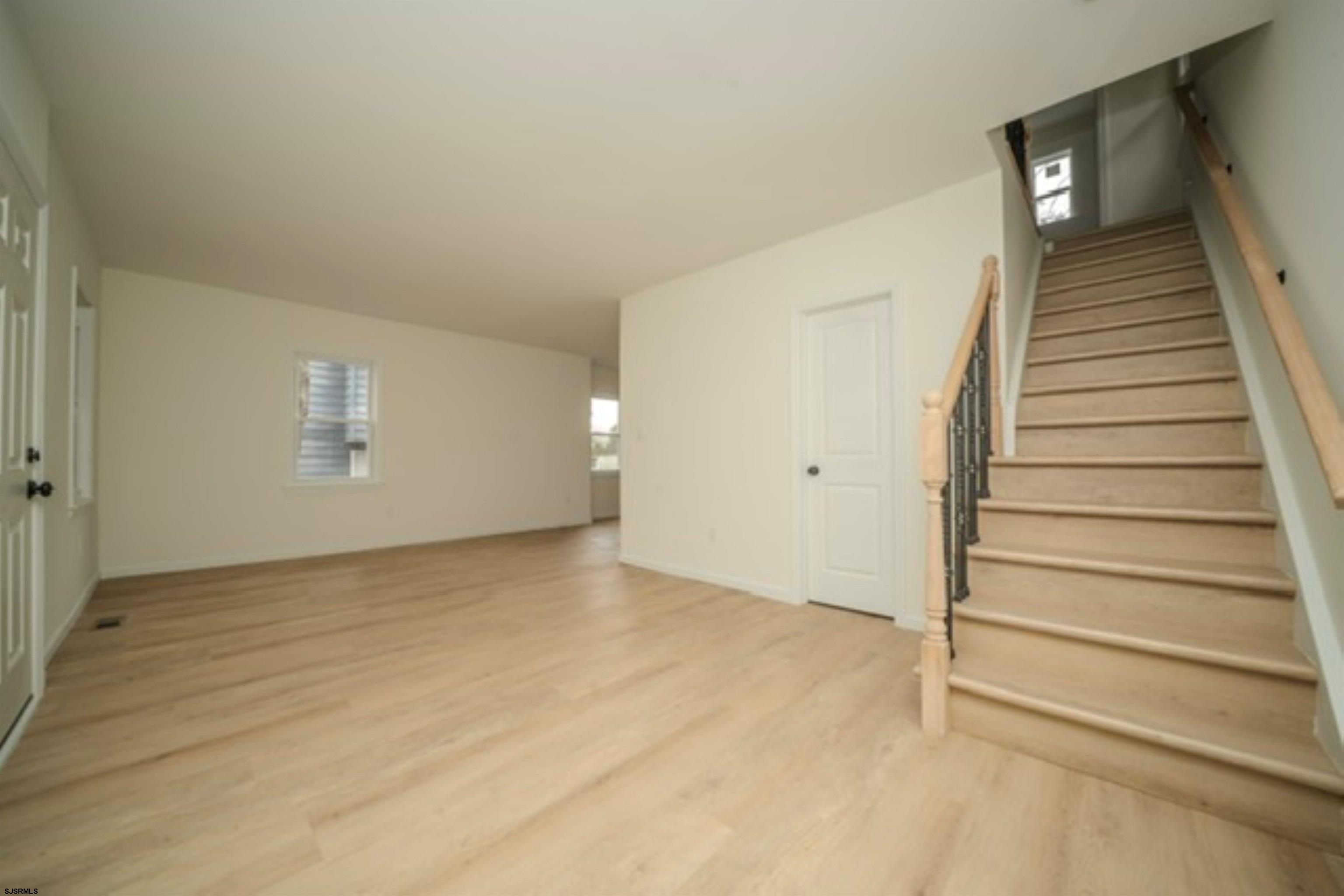 115 Ryon Avenue Pleasantville, NJ 08232 - Photo 10 of 12 a view of an empty room with stairs