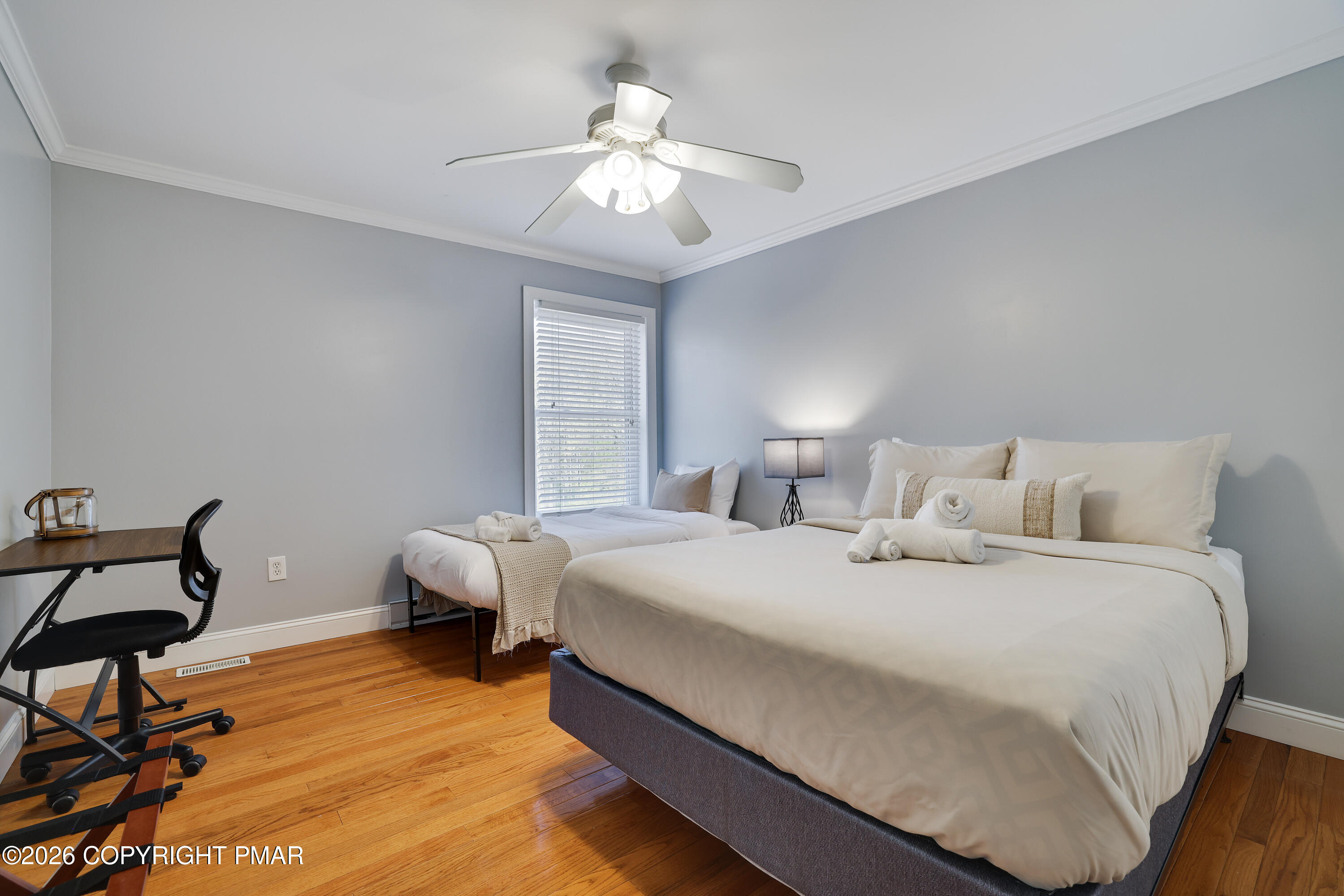 659 Behrens Road Jim Thorpe, PA 18229 - Photo 30 of 57 a spacious bedroom with a bed and a chandelier