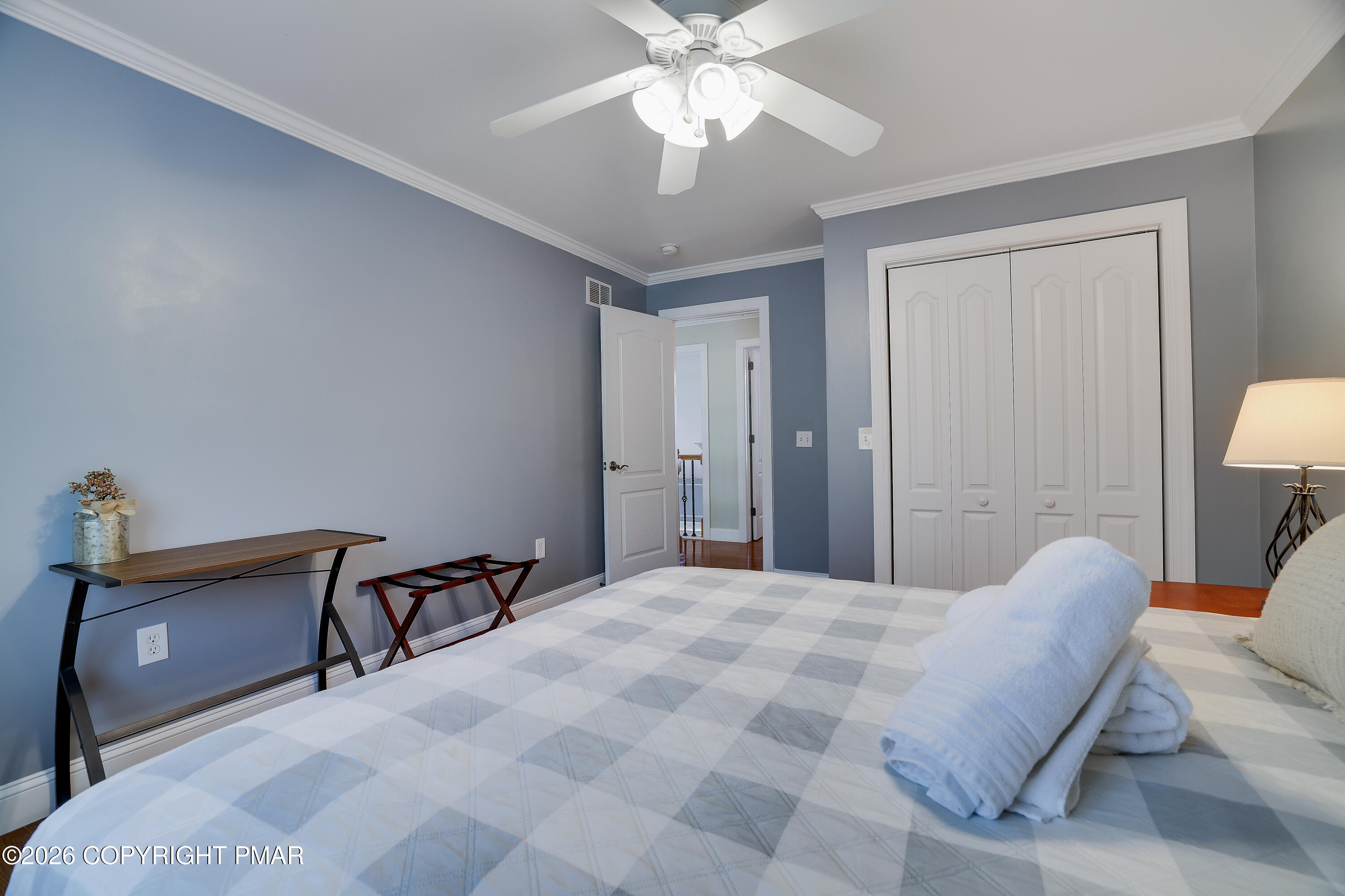659 Behrens Road Jim Thorpe, PA 18229 - Photo 35 of 57 a bedroom with a bed and a chandelier