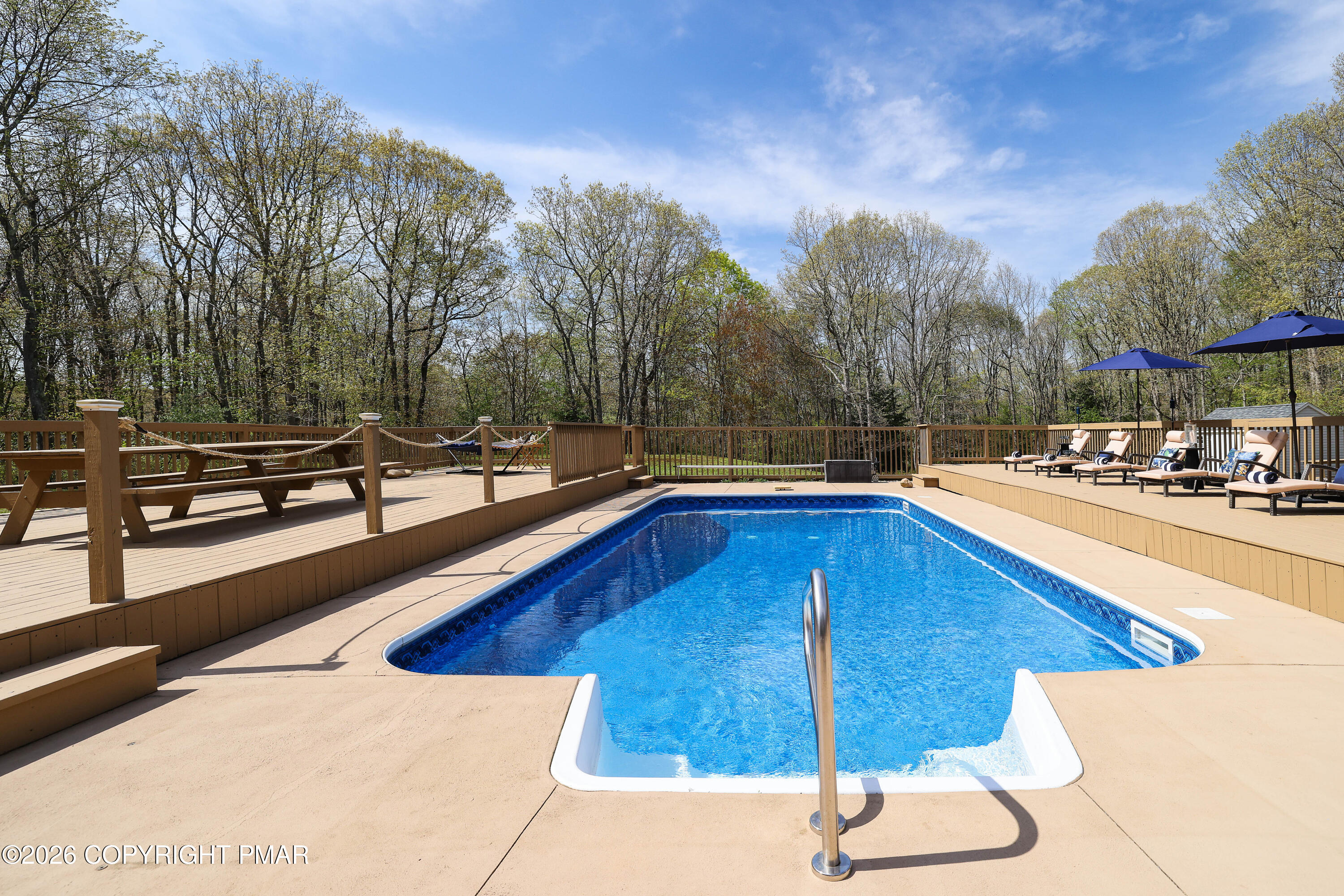 659 Behrens Road Jim Thorpe, PA 18229 - Photo 45 of 57 a view of a swimming pool with a lounge chairs