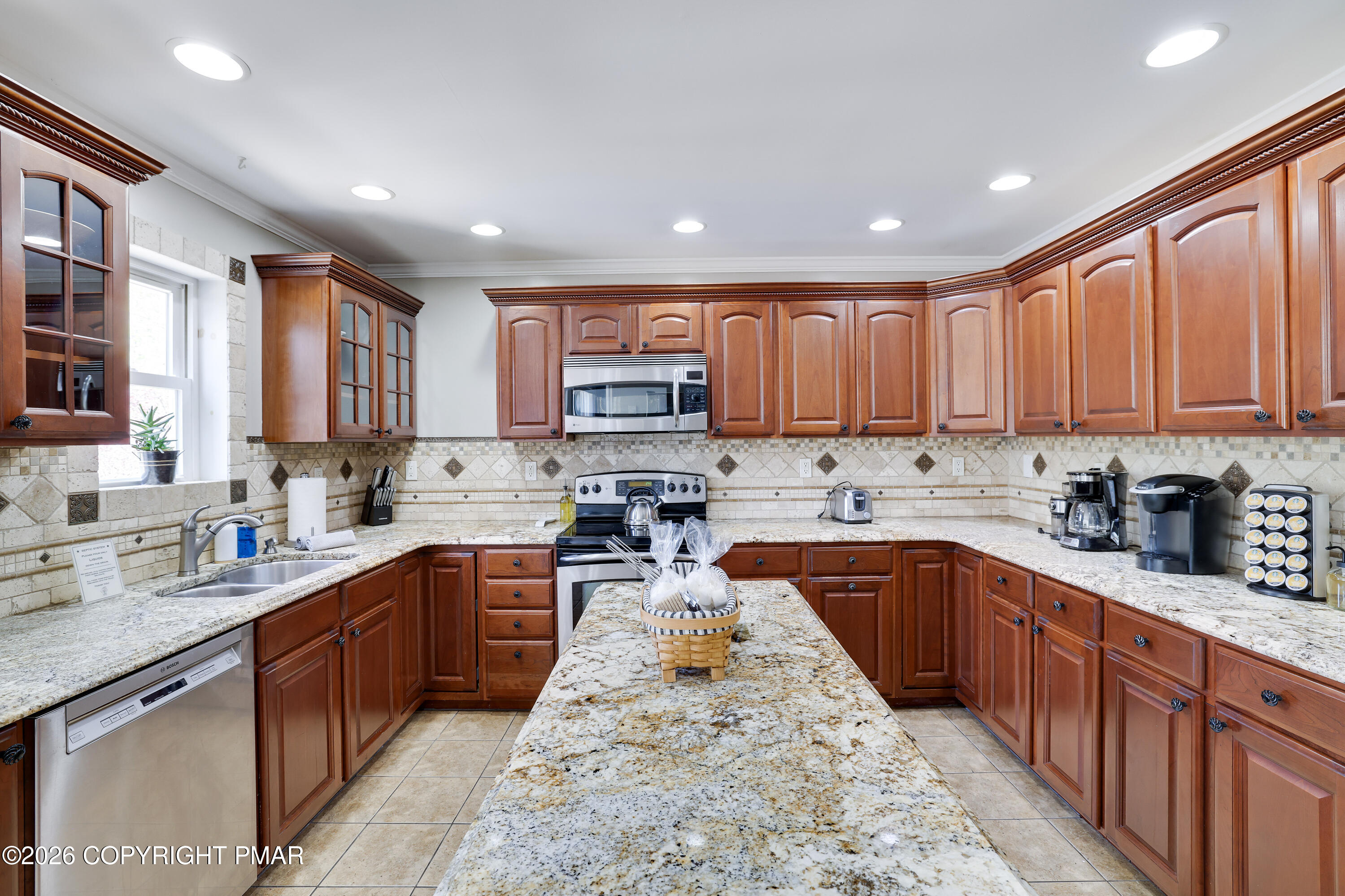 659 Behrens Road Jim Thorpe, PA 18229 - Photo 8 of 57 a kitchen with stainless steel appliances granite countertop wooden cabinets a sink and dishwasher a refrigerator with wooden cabinets