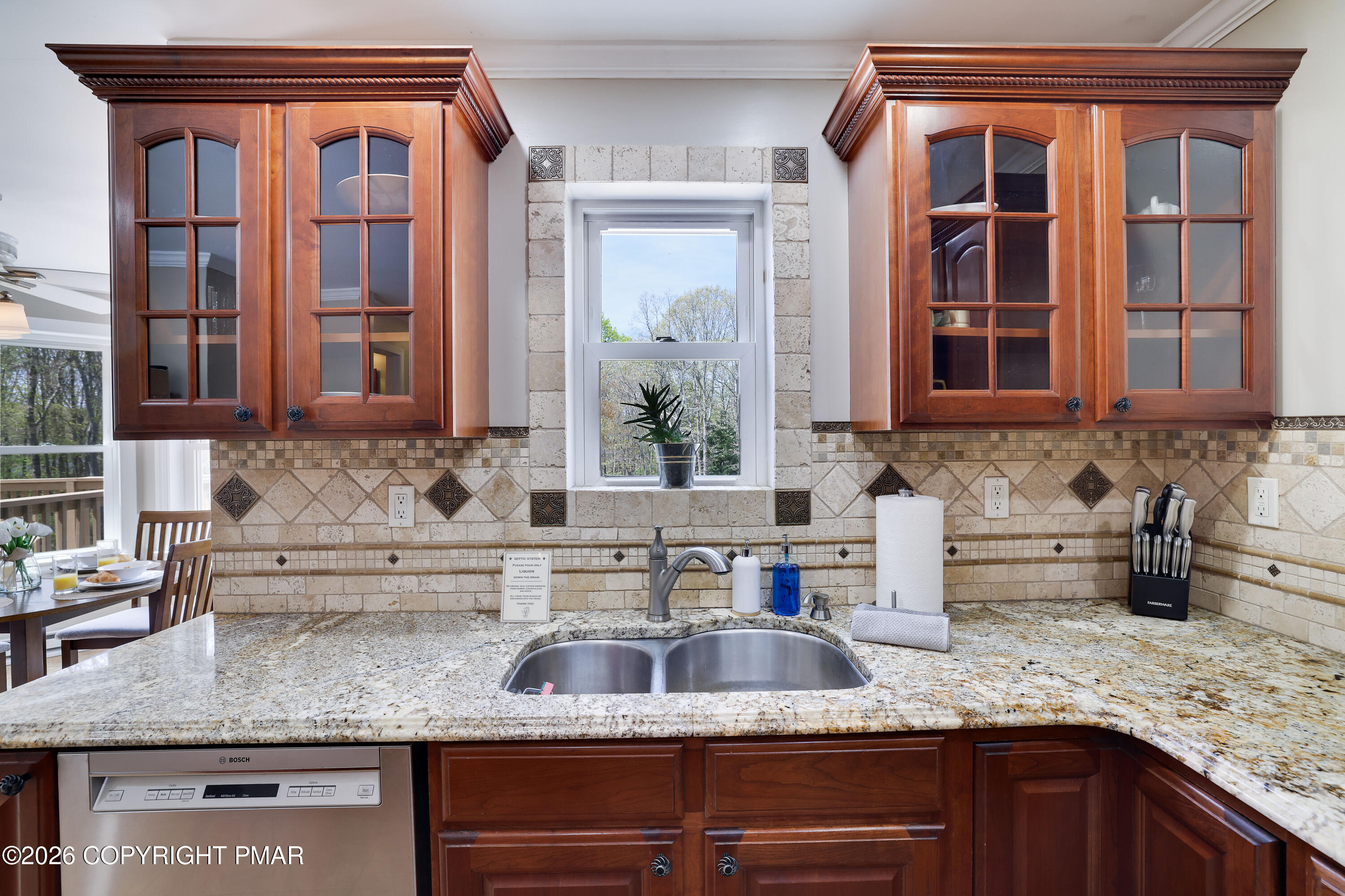659 Behrens Road Jim Thorpe, PA 18229 - Photo 9 of 57 a kitchen with granite countertop a sink and a white wooden cabinets