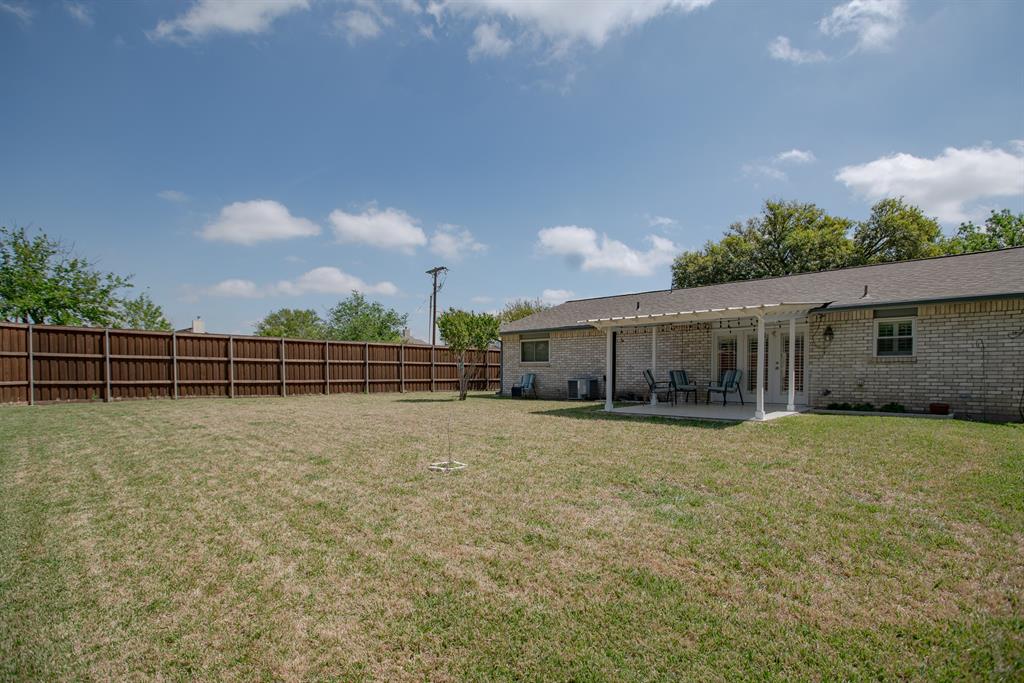 5302 Saddleback Road Garland, TX 75043 - Photo 29 of 31 Spacious back yard with covered back patio.