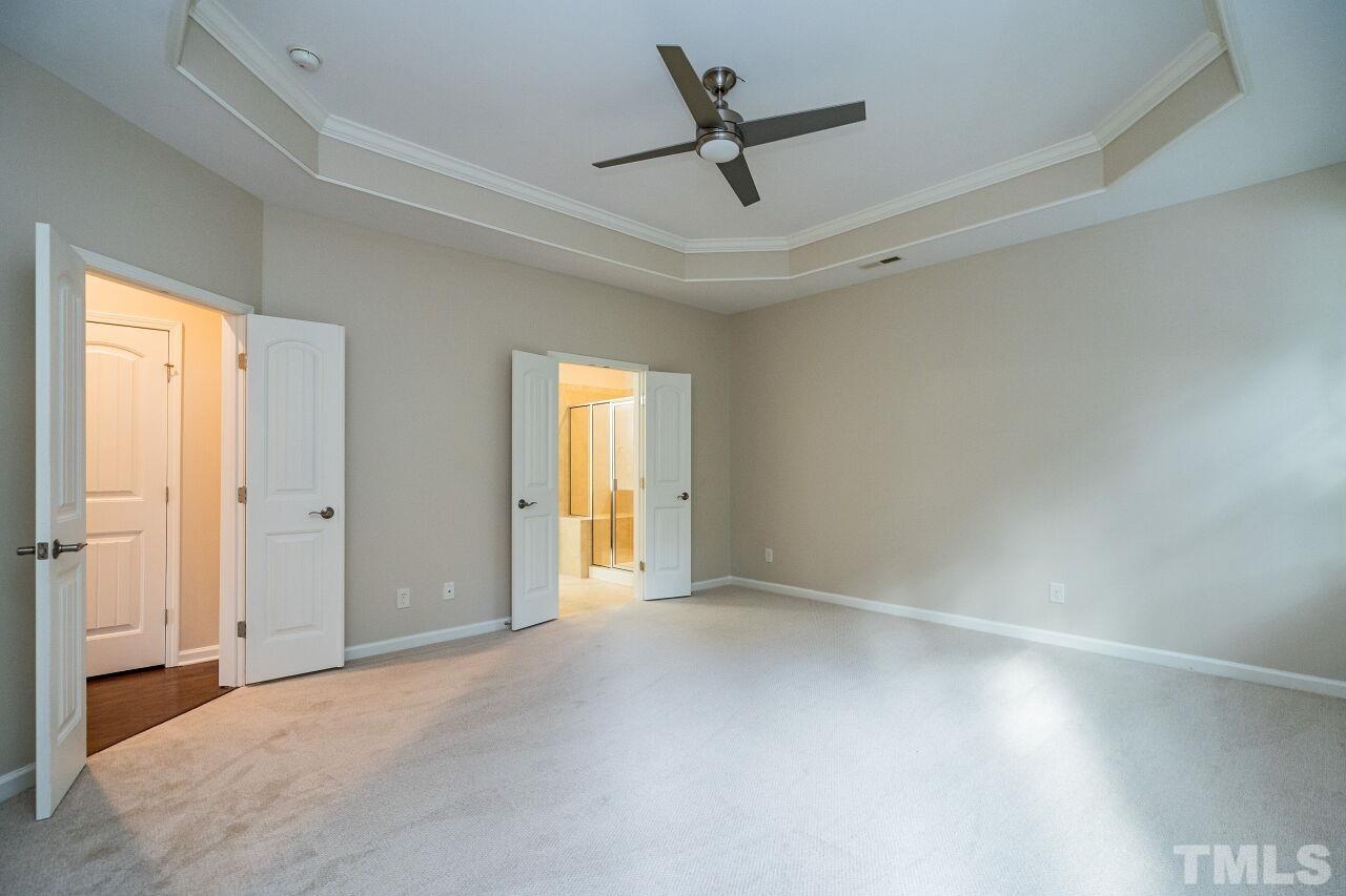 4713 Gaelic Trail Raleigh, NC 27604 - Photo 18 of 26 a view of a livingroom with a ceiling fan and window