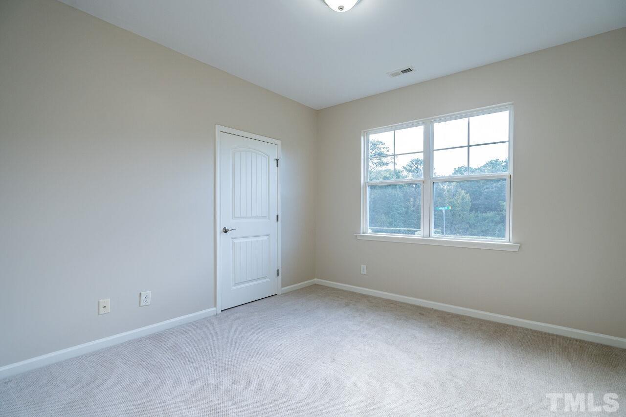 4713 Gaelic Trail Raleigh, NC 27604 - Photo 23 of 26 an empty room with windows