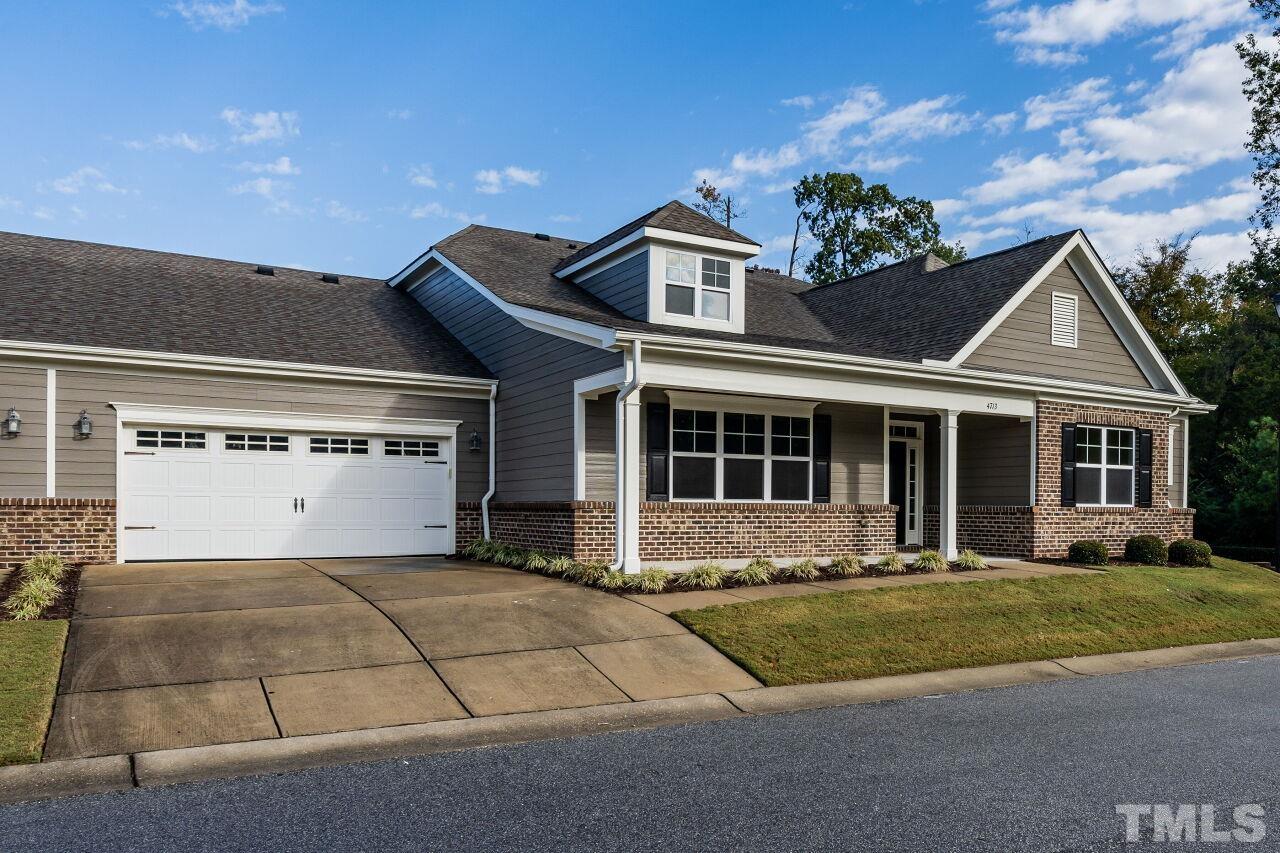 4713 Gaelic Trail Raleigh, NC 27604 - Photo 26 of 26 a front view of a house with a garden and plants