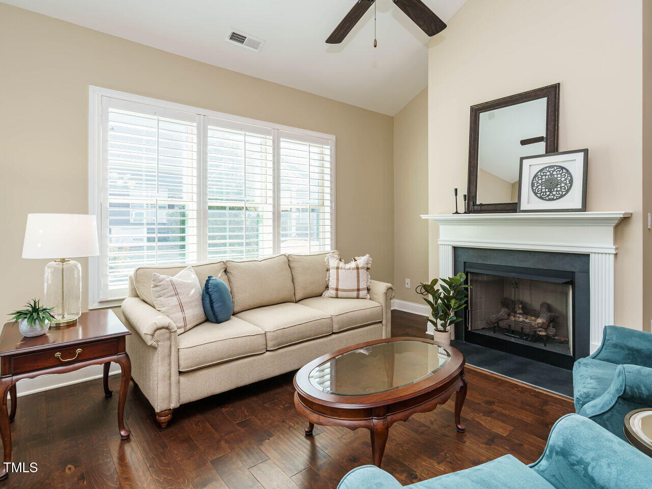 116 Telluride Trail Garner, NC 27529 - Photo 13 of 40 a living room with furniture a window and a fireplace