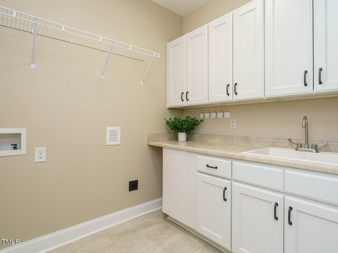 116 Telluride Trail Garner, NC 27529 - Photo 25 of 40 a kitchen with white cabinets and a sink