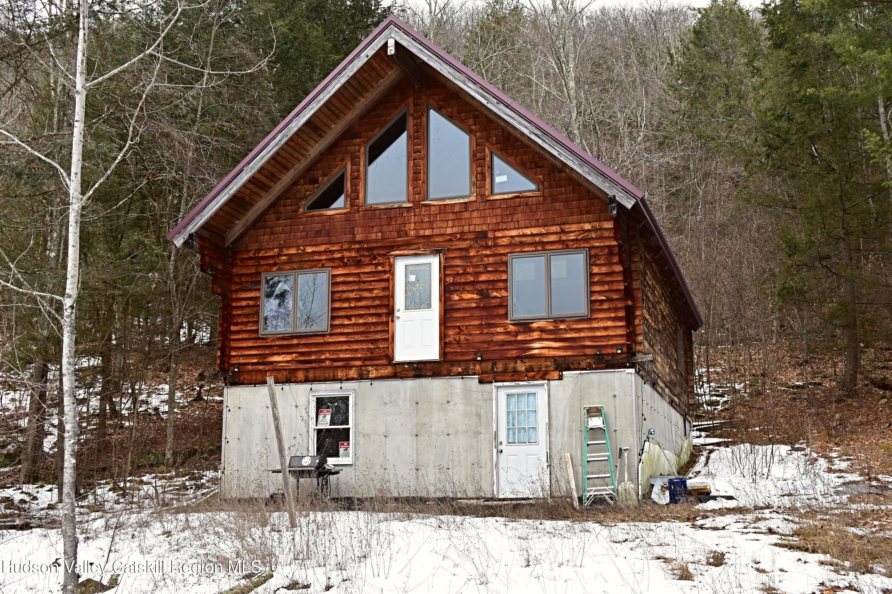 169 Tae Kwon Road North Blenheim, NY 12131 - Photo 3 of 12 a front view of a house with a yard