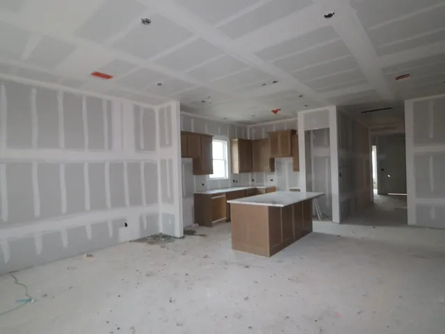 a large room with a large window and counter space