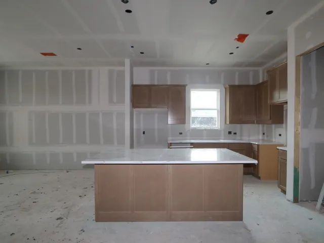 a view of wooden floor and cabinet in a room