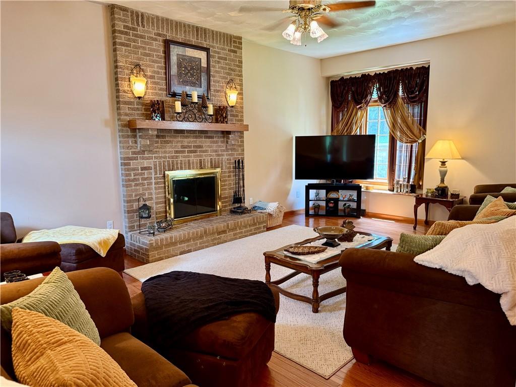 293 Sandy Hill Road Valencia, PA 16059 - Photo 25 of 50 a living room with furniture and a fireplace
