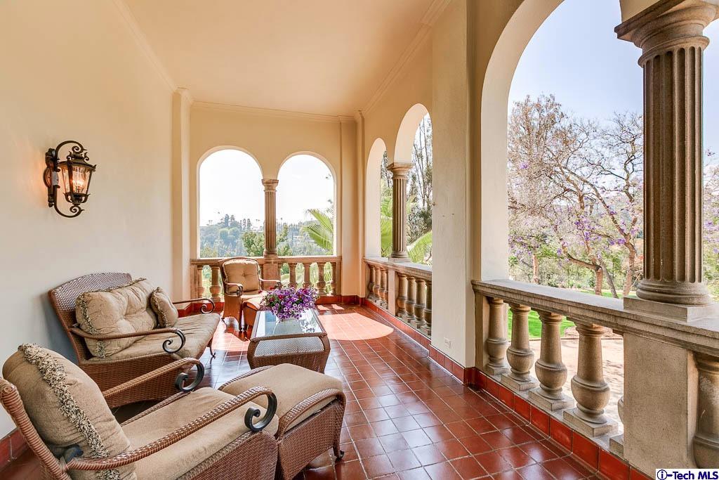 1199 Chateau Road Pasadena, CA 91105 - Photo 15 of 34 a living room with furniture and floor to ceiling windows
