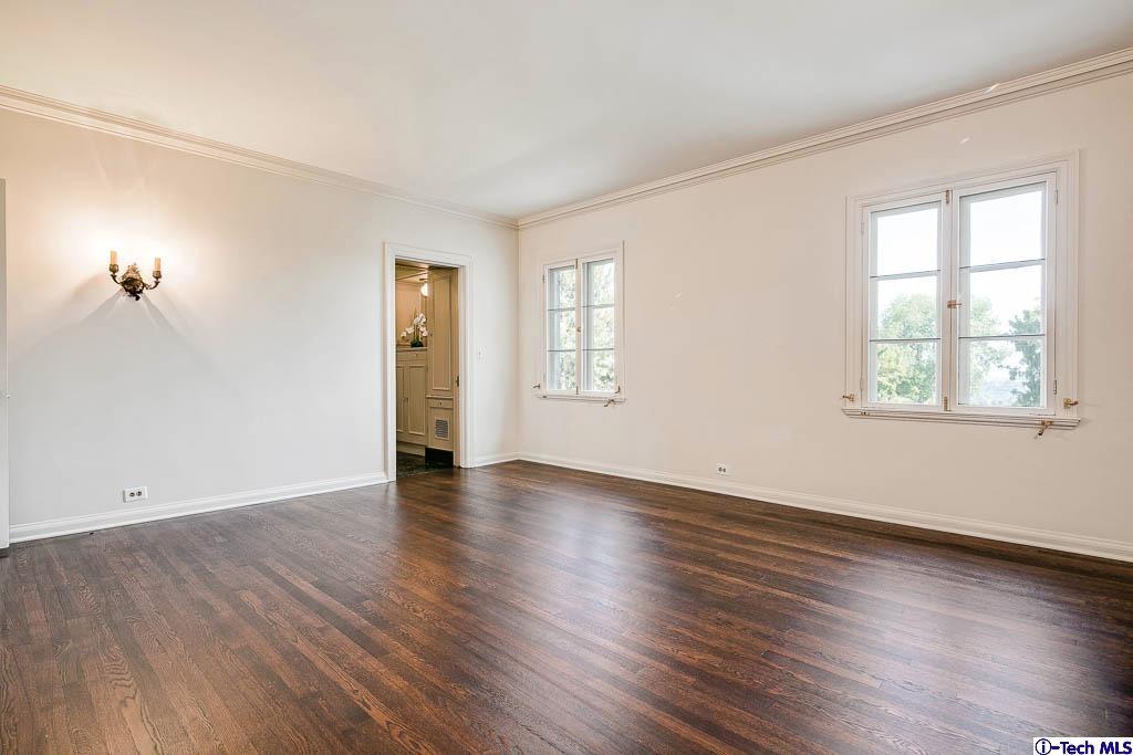 1199 Chateau Road Pasadena, CA 91105 - Photo 22 of 34 a view of an empty room with wooden floor and a window