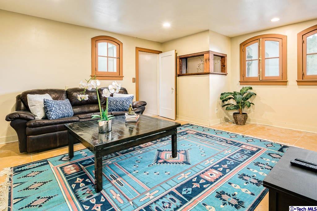 1199 Chateau Road Pasadena, CA 91105 - Photo 29 of 34 a living room with furniture and a table