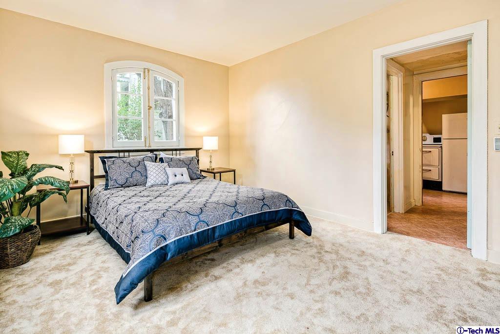 1199 Chateau Road Pasadena, CA 91105 - Photo 30 of 34 a bedroom with a bed and window