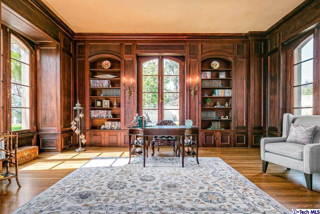 1199 Chateau Road Pasadena, CA 91105 - Photo 8 of 34 a living room with furniture a fireplace and large windows