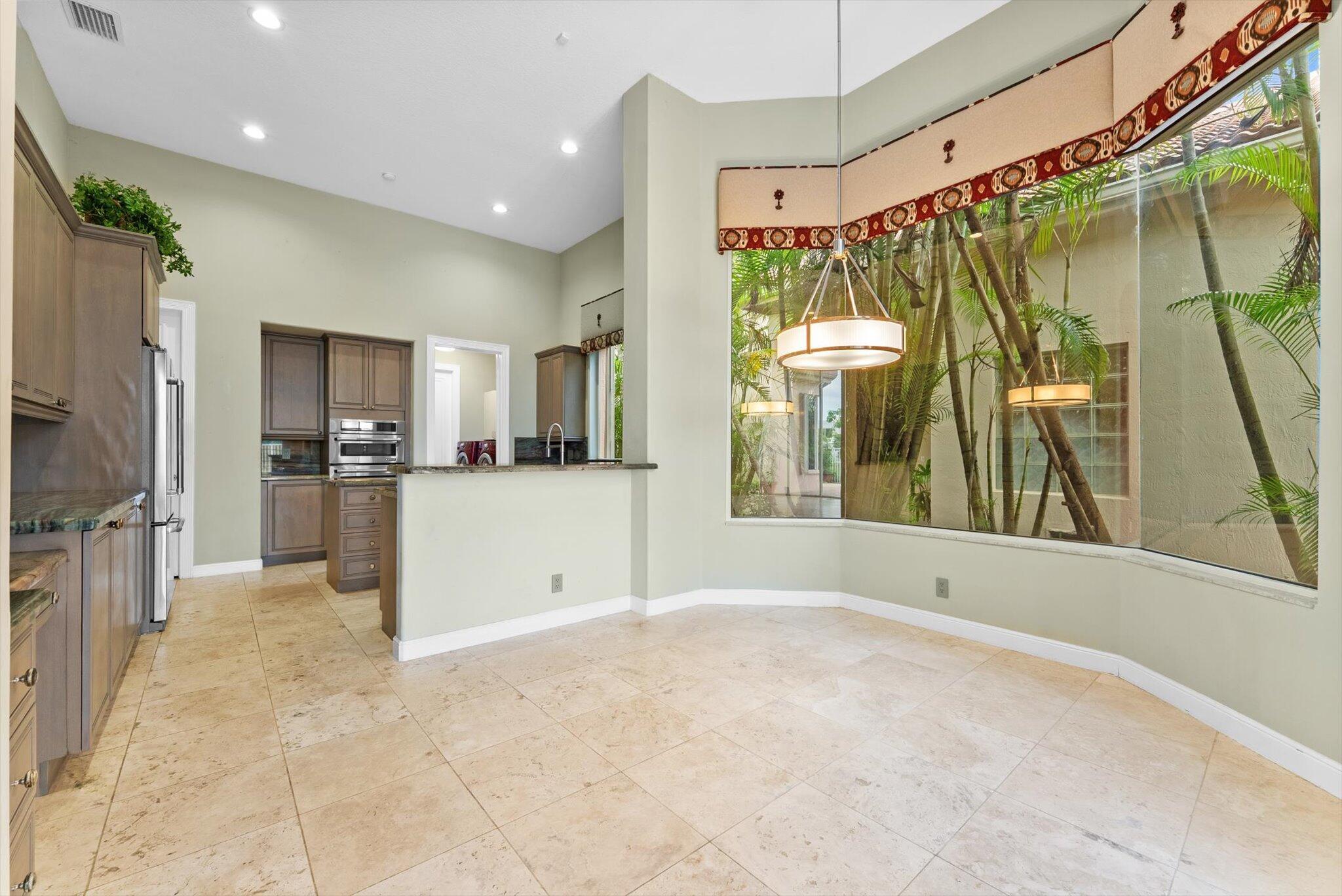 7081 Mallorca Crescent Boca Raton, FL 33433 - Photo 6 of 26 a view of a bathroom with a sink and mirror