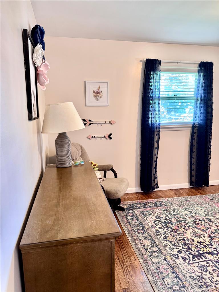 5334 Egypt Road Laurys Station, PA 18059 - Photo 27 of 55 Hardwood floors and patterned rug accent this naturally illuminated room with window treatments.