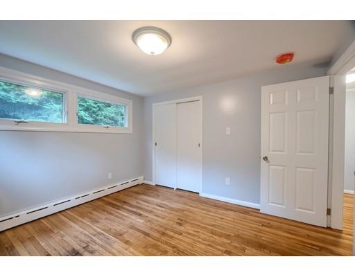 218 Ellis Road Westminster, MA 01473 - Photo 19 of 30 an empty room with wooden floor and windows