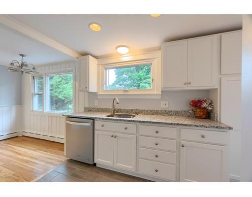 218 Ellis Road Westminster, MA 01473 - Photo 4 of 30 a kitchen with granite countertop white cabinets and window