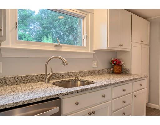 218 Ellis Road Westminster, MA 01473 - Photo 5 of 30 a kitchen with granite countertop white cabinets and window