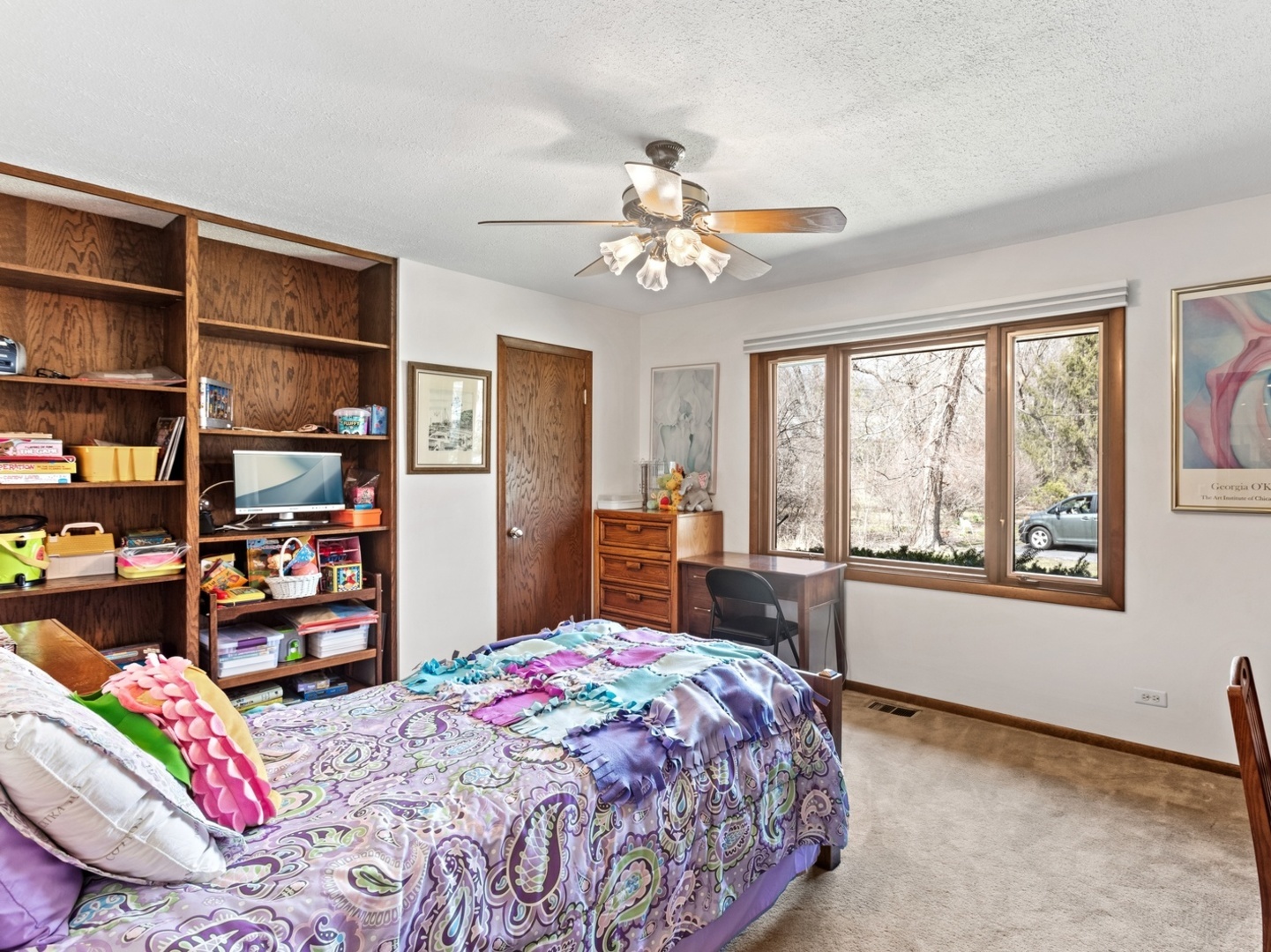 470 East Westleigh Road Lake Forest, IL 60045 - Photo 16 of 28 a bedroom with a bed a dresser and a large window