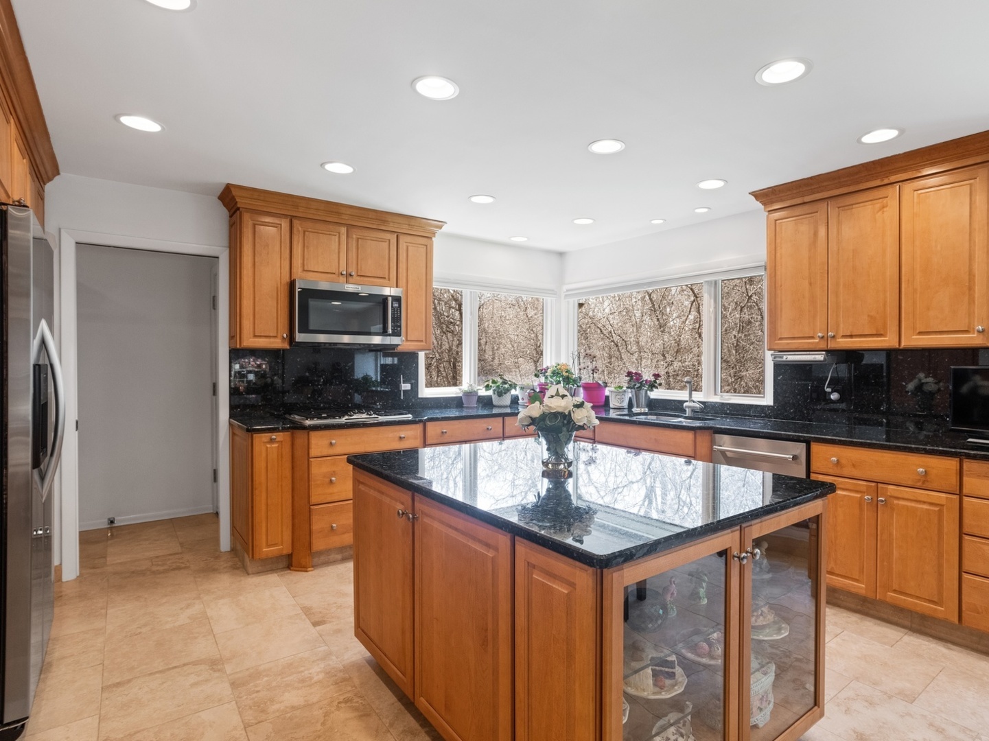 470 East Westleigh Road Lake Forest, IL 60045 - Photo 10 of 28 a kitchen with stainless steel appliances granite countertop a sink a stove and a refrigerator