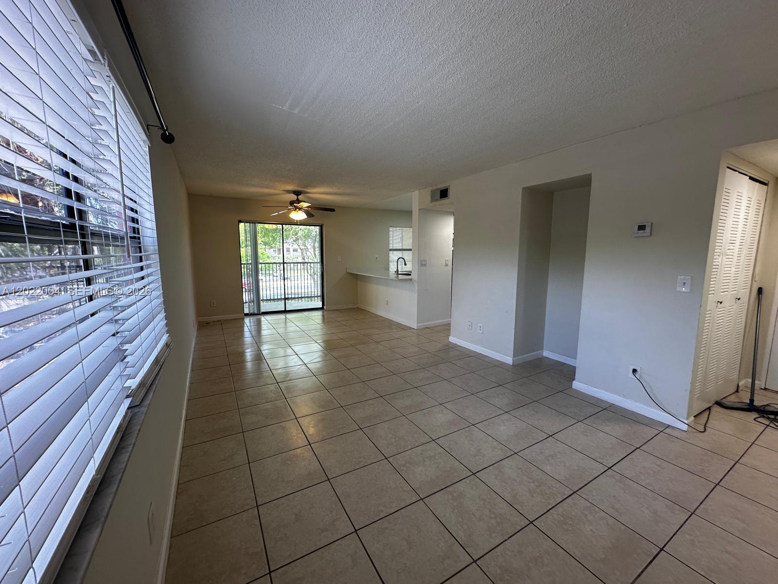 3400 Foxcroft Road, Unit 301 Miramar, FL 33025 - Photo 58 of 72 a view of a hallway with wooden floor