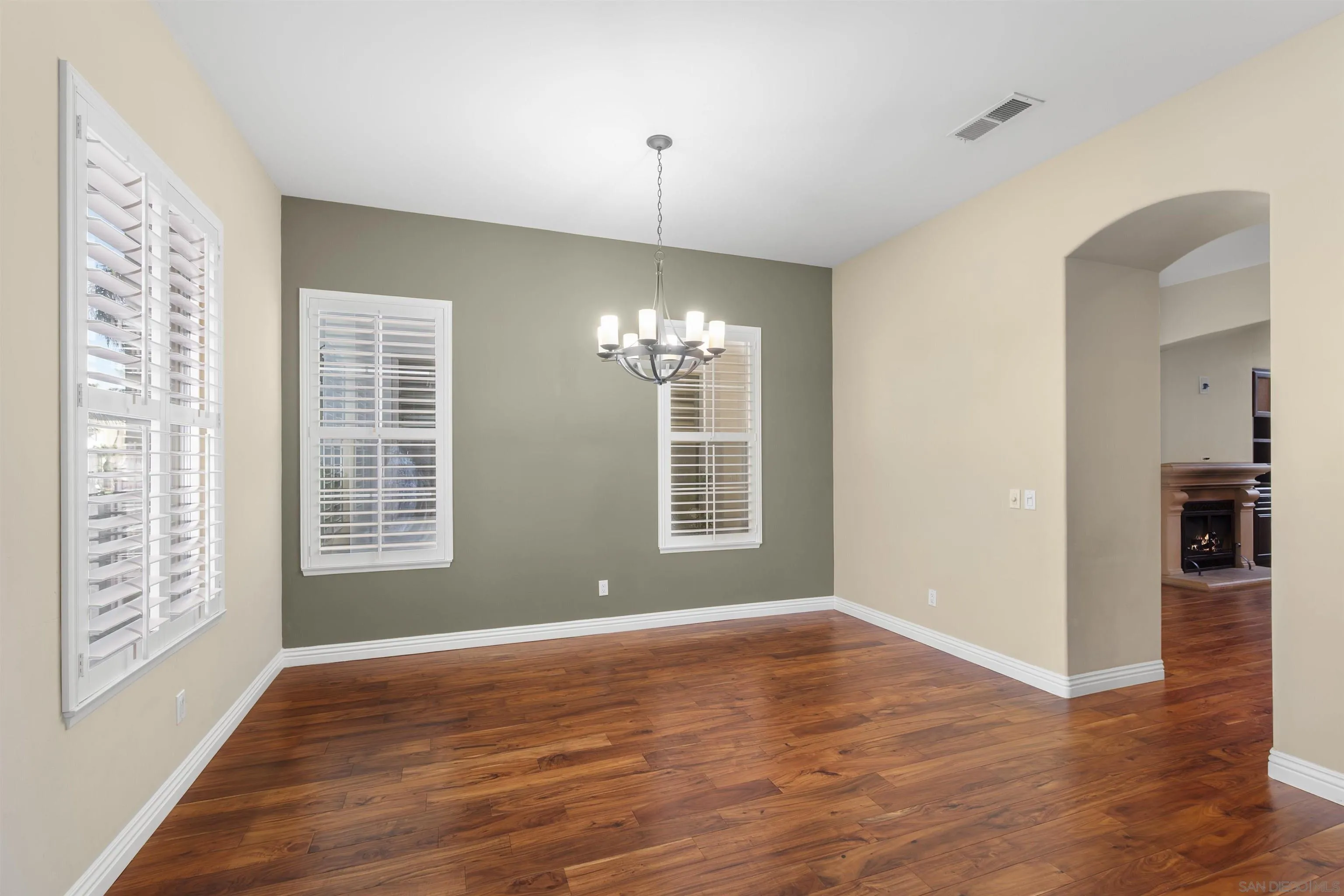 2873 West Bainbridge Road San Diego, CA 92106 - Photo 11 of 54 a view of an empty room with window and wooden floor