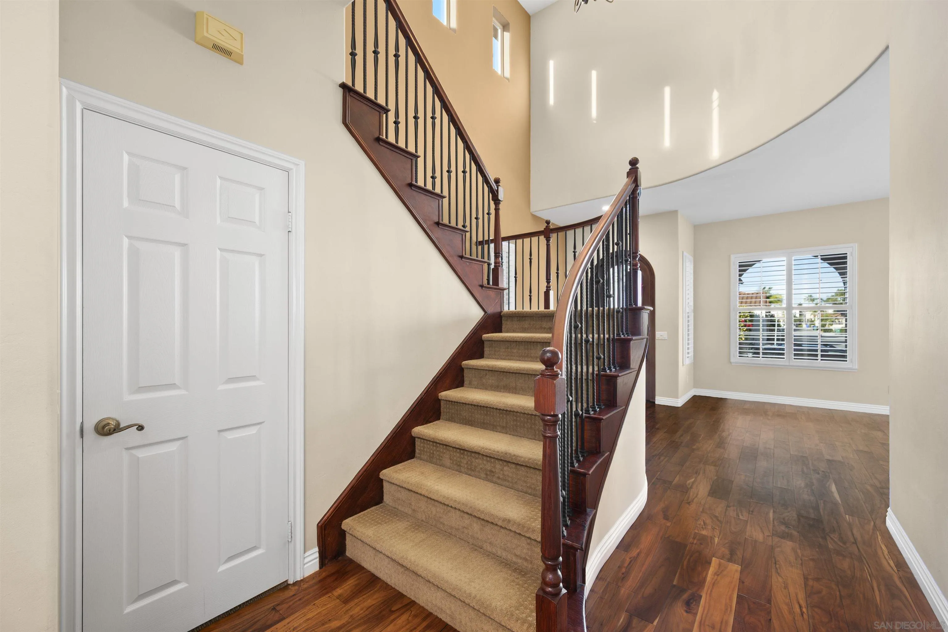 2873 West Bainbridge Road San Diego, CA 92106 - Photo 24 of 54 a view of entryway with wooden floor and stairs