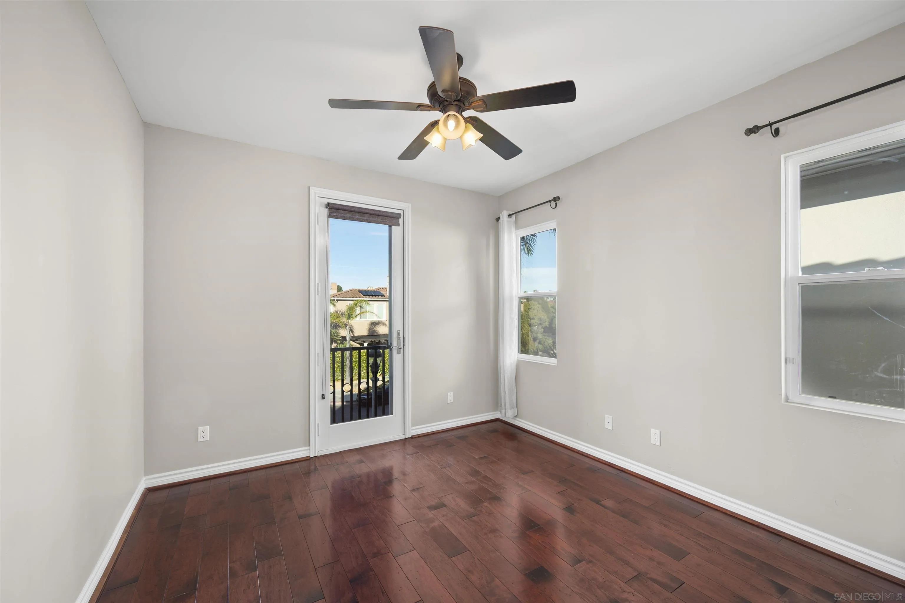 2873 West Bainbridge Road San Diego, CA 92106 - Photo 37 of 54 a view of empty room with wooden floor and fan