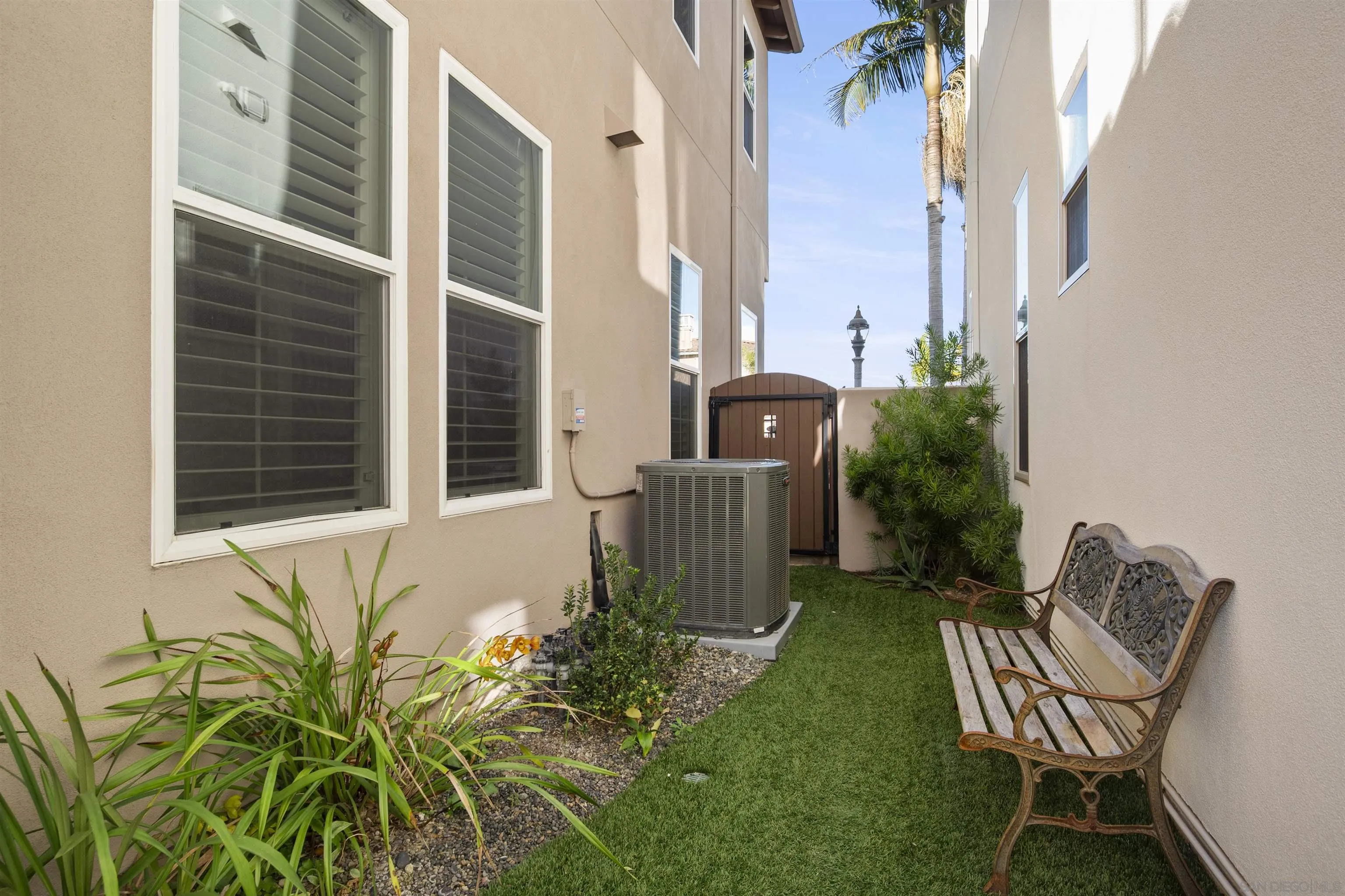 2873 West Bainbridge Road San Diego, CA 92106 - Photo 45 of 54 a view of backyard with wheel chair and potted plants