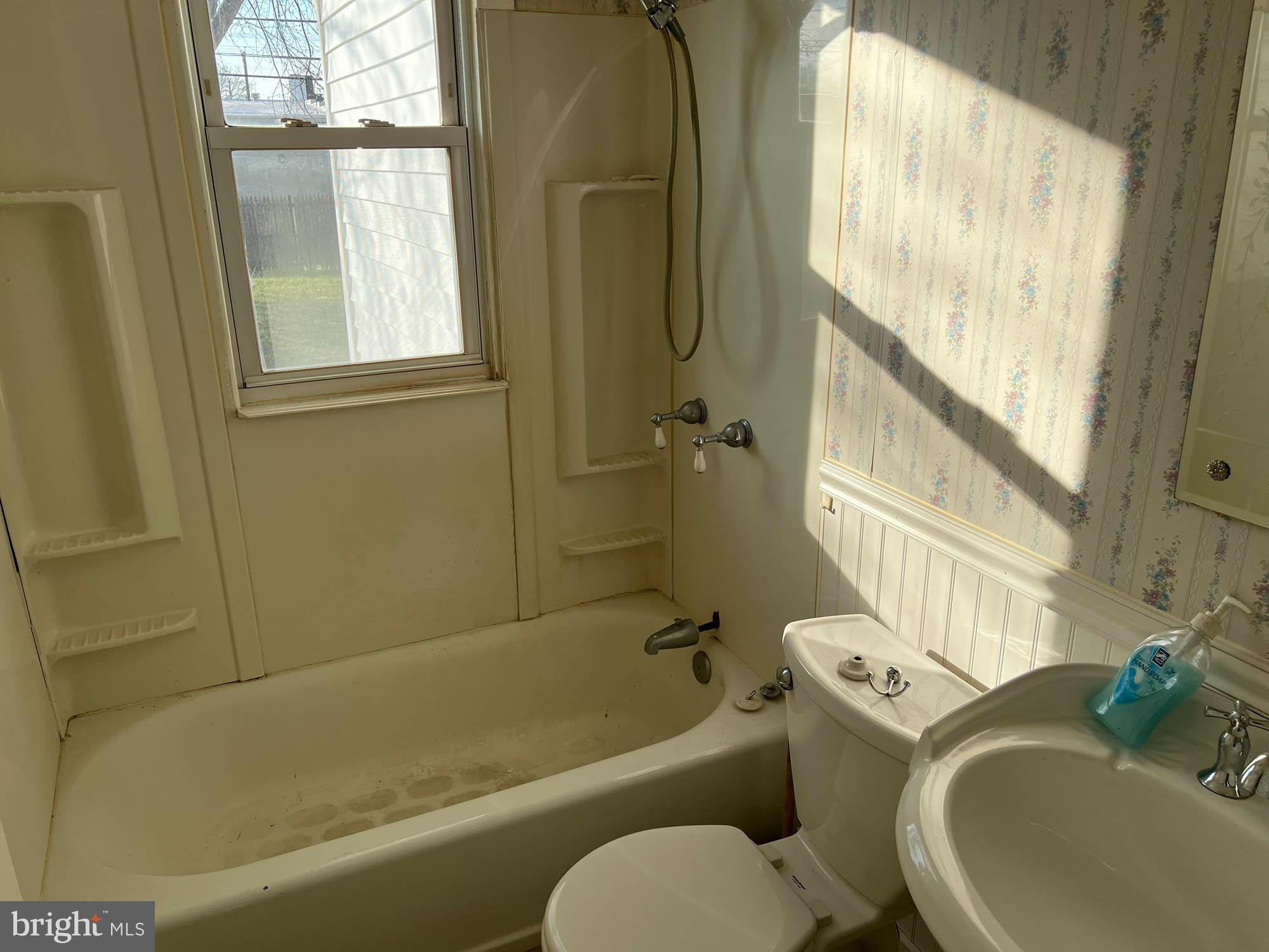 54 Riverside Road Baltimore, MD 21221 - Photo 8 of 14 a bathroom with a sink toilet and shower