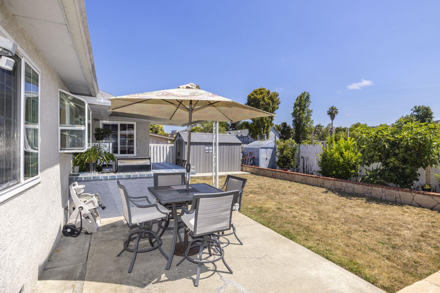 27906 Thackeray Avenue Hayward, CA 94544 - Photo 13 of 14 a patio with a patio table and chairs