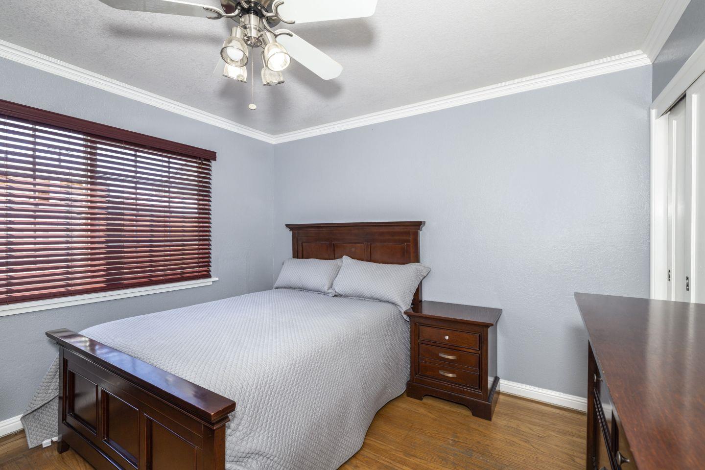 27906 Thackeray Avenue Hayward, CA 94544 - Photo 6 of 14 a bedroom with a bed and a chandelier