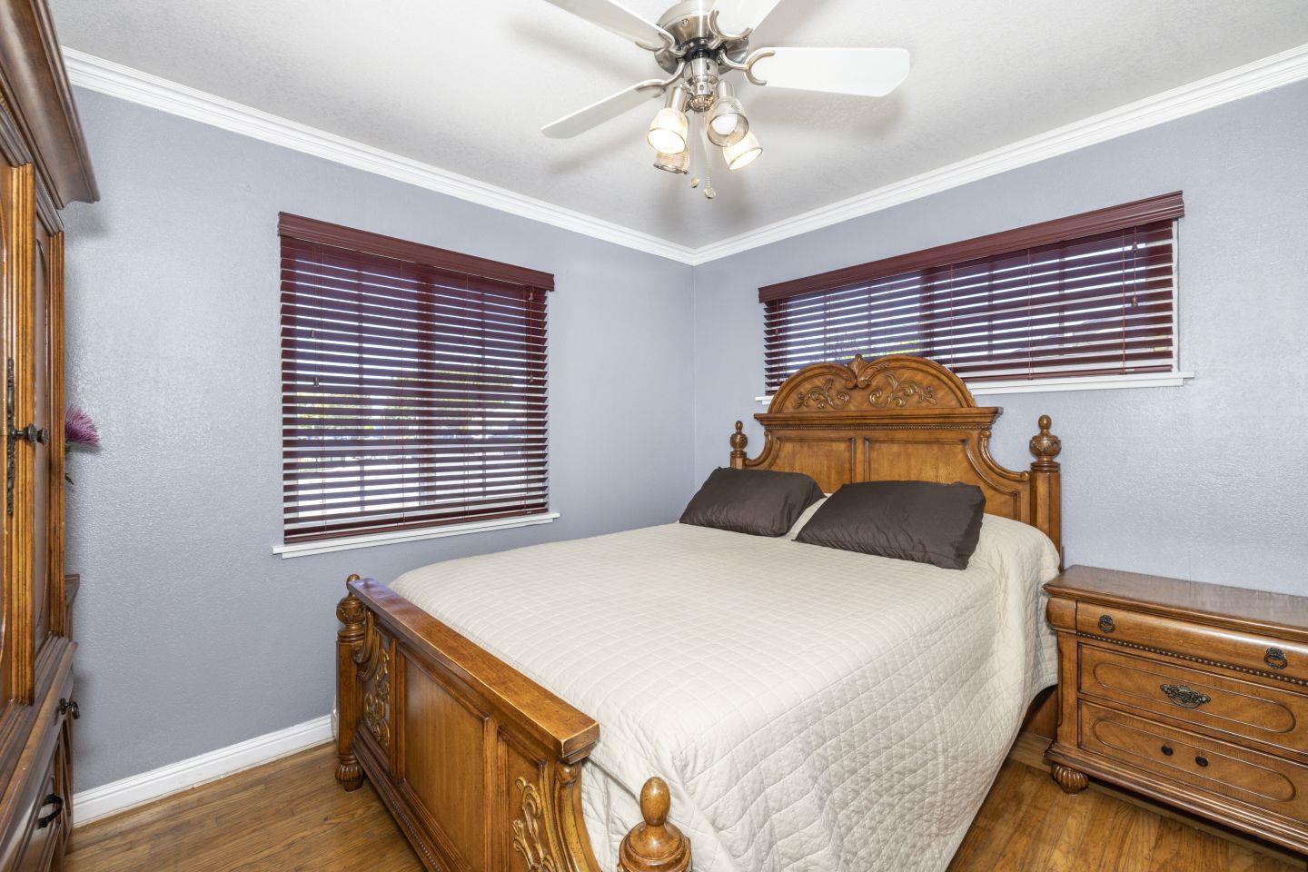 27906 Thackeray Avenue Hayward, CA 94544 - Photo 7 of 14 a bedroom with a bed and a chandelier