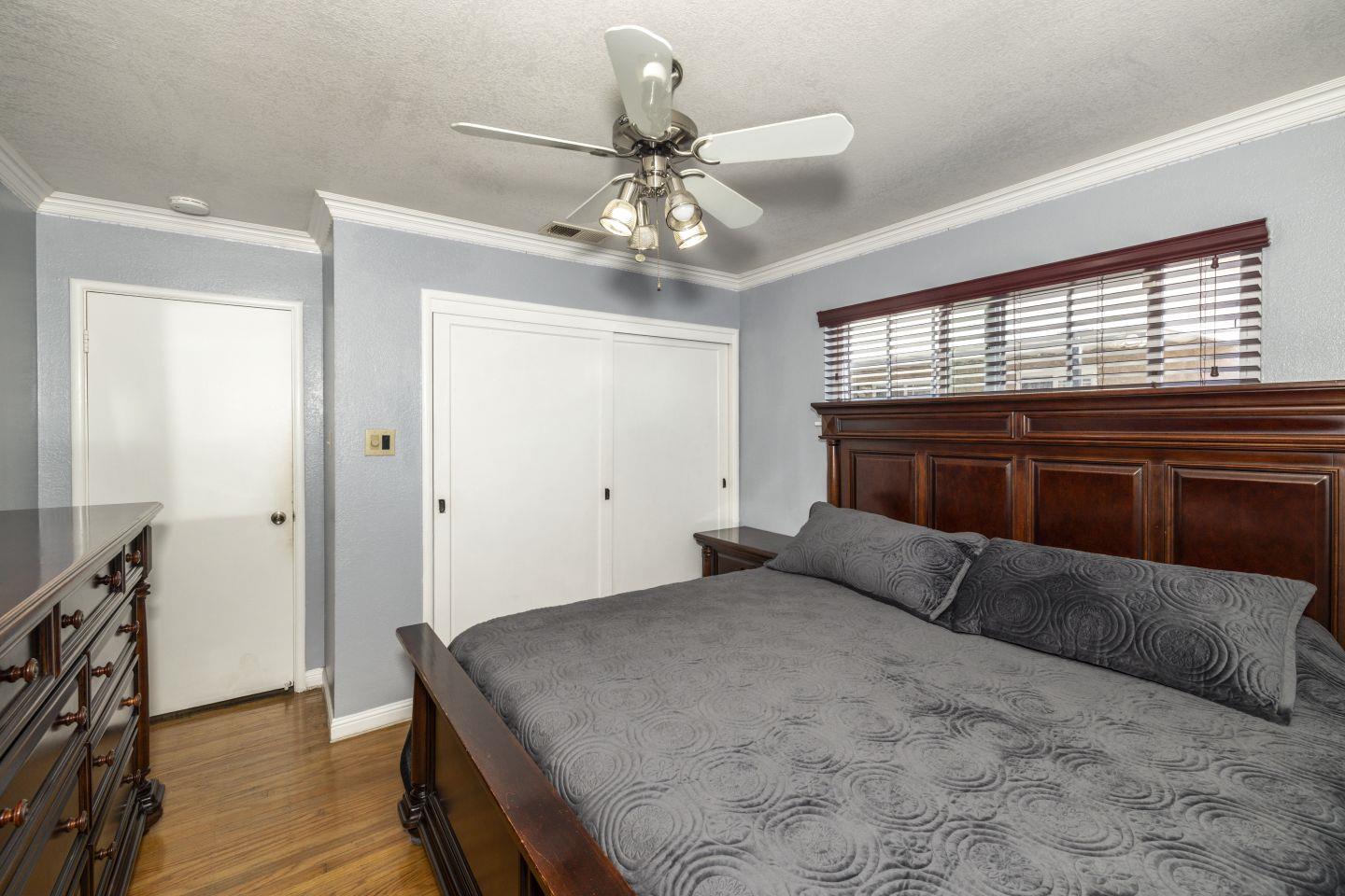 27906 Thackeray Avenue Hayward, CA 94544 - Photo 9 of 14 a bedroom with a large bed and a chandelier