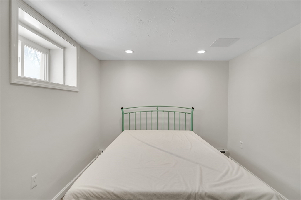 10 Dexter Road Lexington, MA 02420 - Photo 31 of 35 a large white bed in a white room